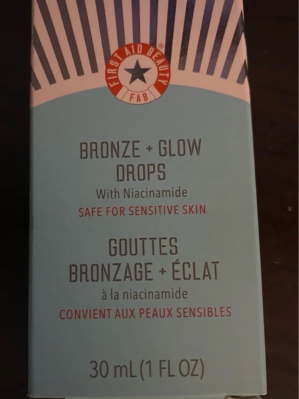 First Aid Beauty Light Blue Skincare Box with Red Accent